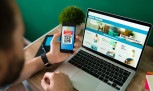 Young man using a discount coupon on his smartphone to do some online shopping on the laptop
     -  (crédito:  Antonio Diaz)